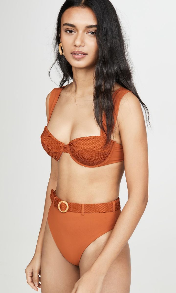 Bikini by We Wore What in burnt orange with thick straps and cups on the top and belted bottom