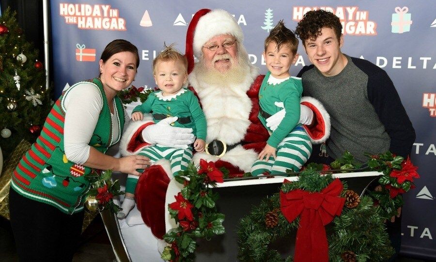 December 13: Nolan Gould and Santa posed with guests as they surprised 150 children from Children's Hospital Los Angeles and P.S. ARTS, at Delta Air Lines' sixth annual Holiday in the Hangar Celebration in L.A.
Photo: Michael Kovac/Getty Images for Delta AirLines