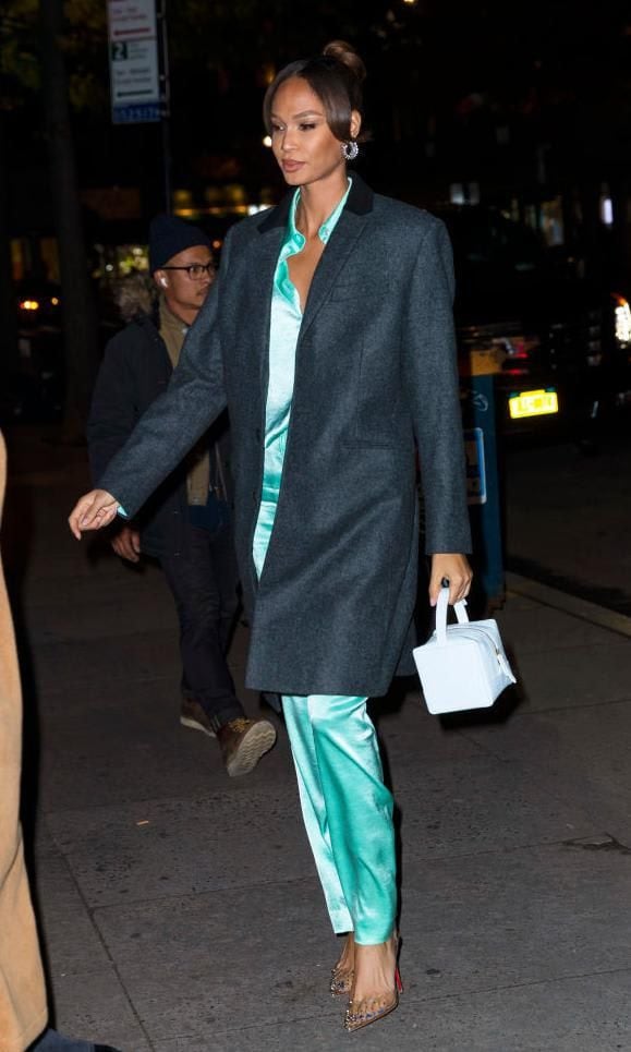 Joan Smalls with a box style bag