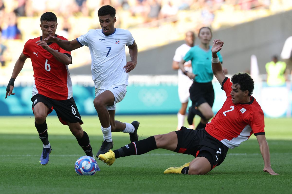 Egypt's midfielder #02 Omar Fayed fights for the ball with Dominican Republic's forward #07 Oscar Urena during the men's group C football match between Egypt and the Dominican Republic during the Paris 2024 Olympic Games at the La Beaujoire Stadium in Nantes on July 24, 2024. 