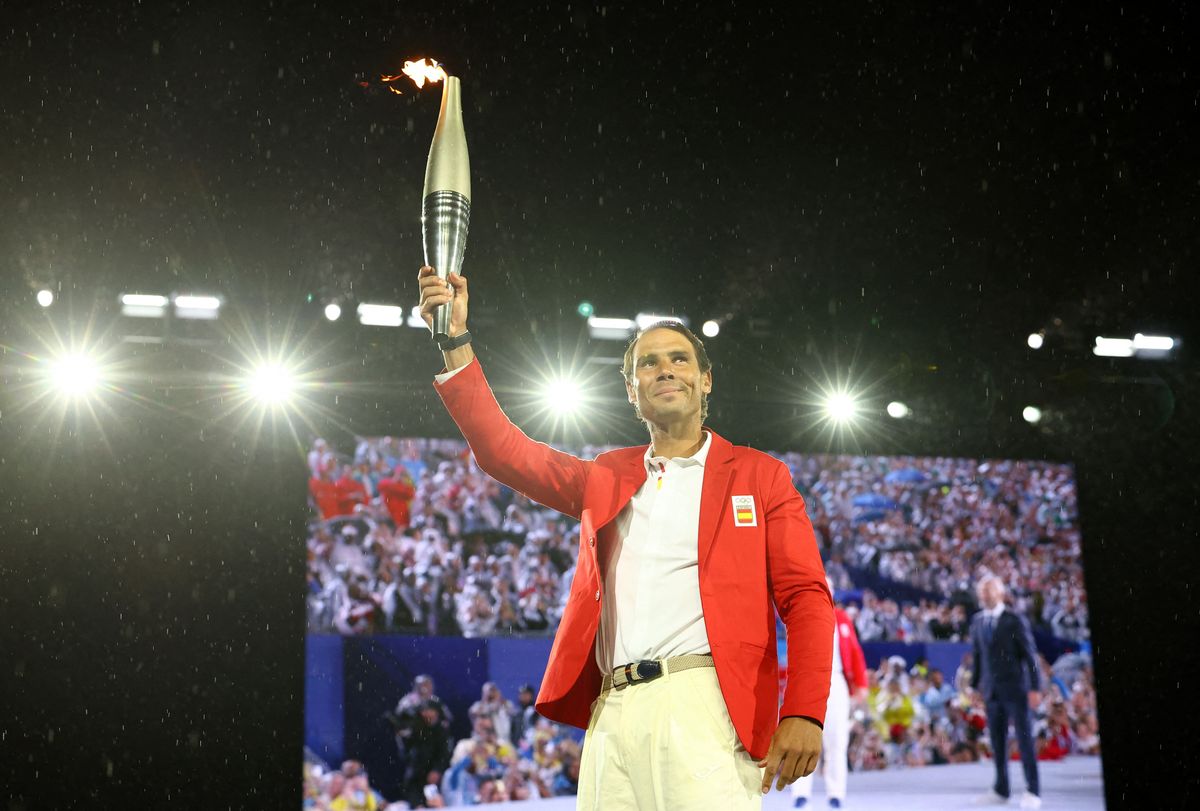 Rafael Nadal of Spain carries the Olympic torch during the Opening Ceremony of the Olympic Games Paris 2024 