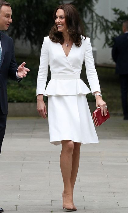 The Duchess of Cambridge opted for Alexander McQueen in one of her favorite wardrobe hues, white, to kick off the royal tour of Poland and Germany on July 17, 2017. Kate looked absolutely stunning as she arrived in Warsaw with her husband Prince William and her children Prince George and Princess Charlotte, wearing a tailored peplum design in ivory wool and silk-blend twill.
Photo: Getty Images