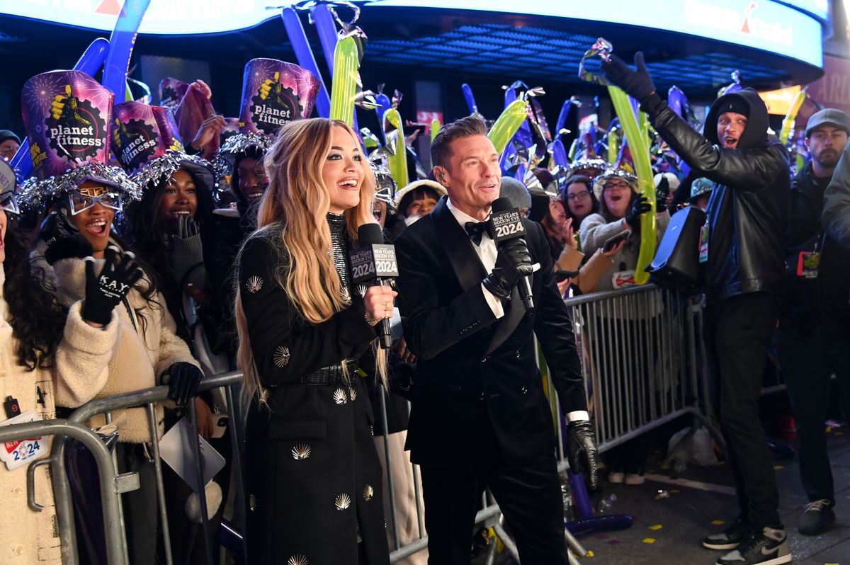 Rita Ora and Ryan Seacrest speak during Dick Clark's New Year's Rockin' Eve with Ryan Seacrest 2024 in Times Square