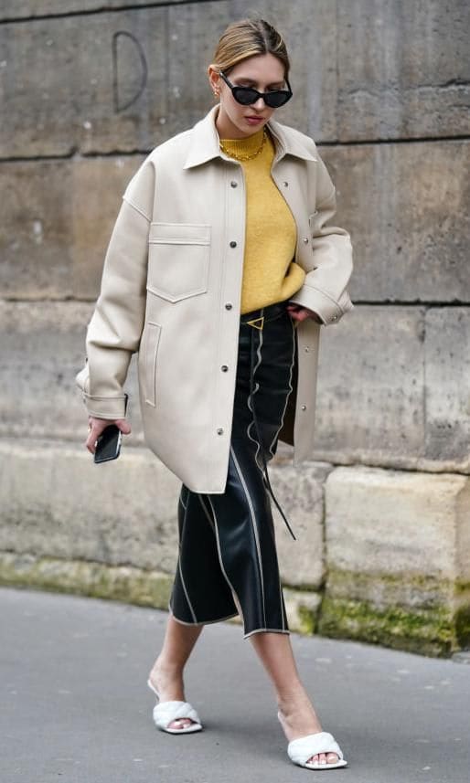 Street style look with a midi skirt and white padded sandals