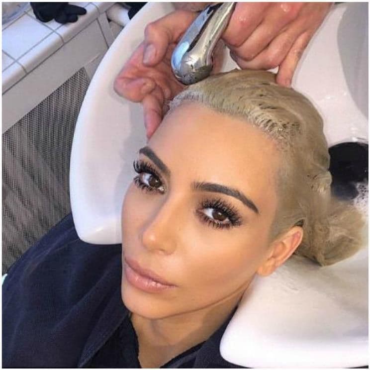 Kim Kardashian under going an Olaplex treatment