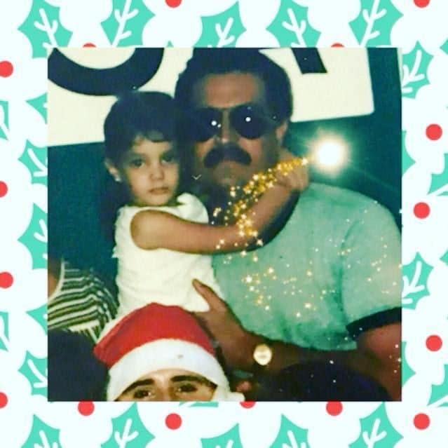 Young Dayanara Torres in her dad's arms