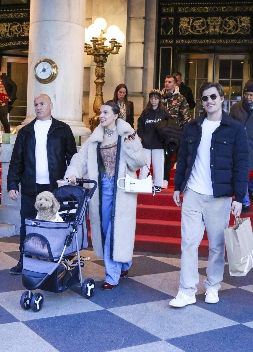 Millie Bobby Brown and boyfriend Jake Bongiovi are all smiles as they step out in style with their doggy Winnie on a baby carriage 