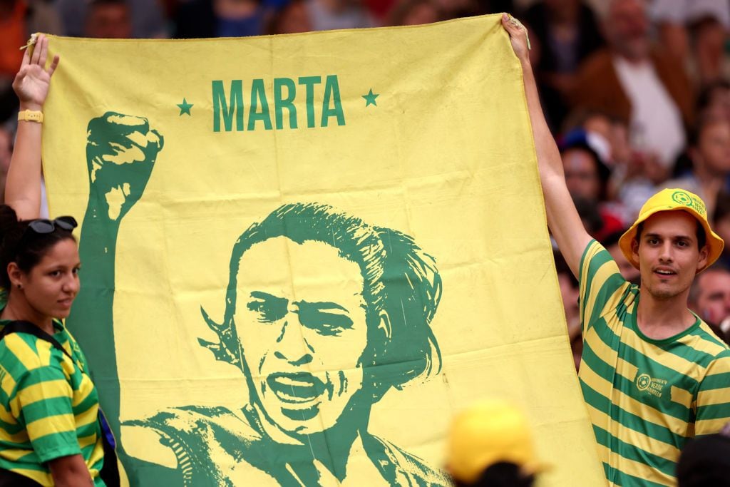 Fans of Team Brazil hold a flag with a picture of Marta prior to  the Women's Quarterfinal match between France and Brazil during the Olympic Games Paris 2024