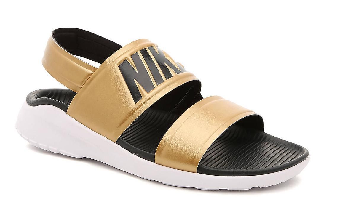 Flat sandals in gold and white by Nike