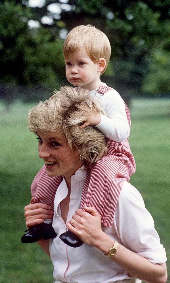 A photo of Prince Harry sitting on Princess Diana's shoulders is featured on the site's homepage