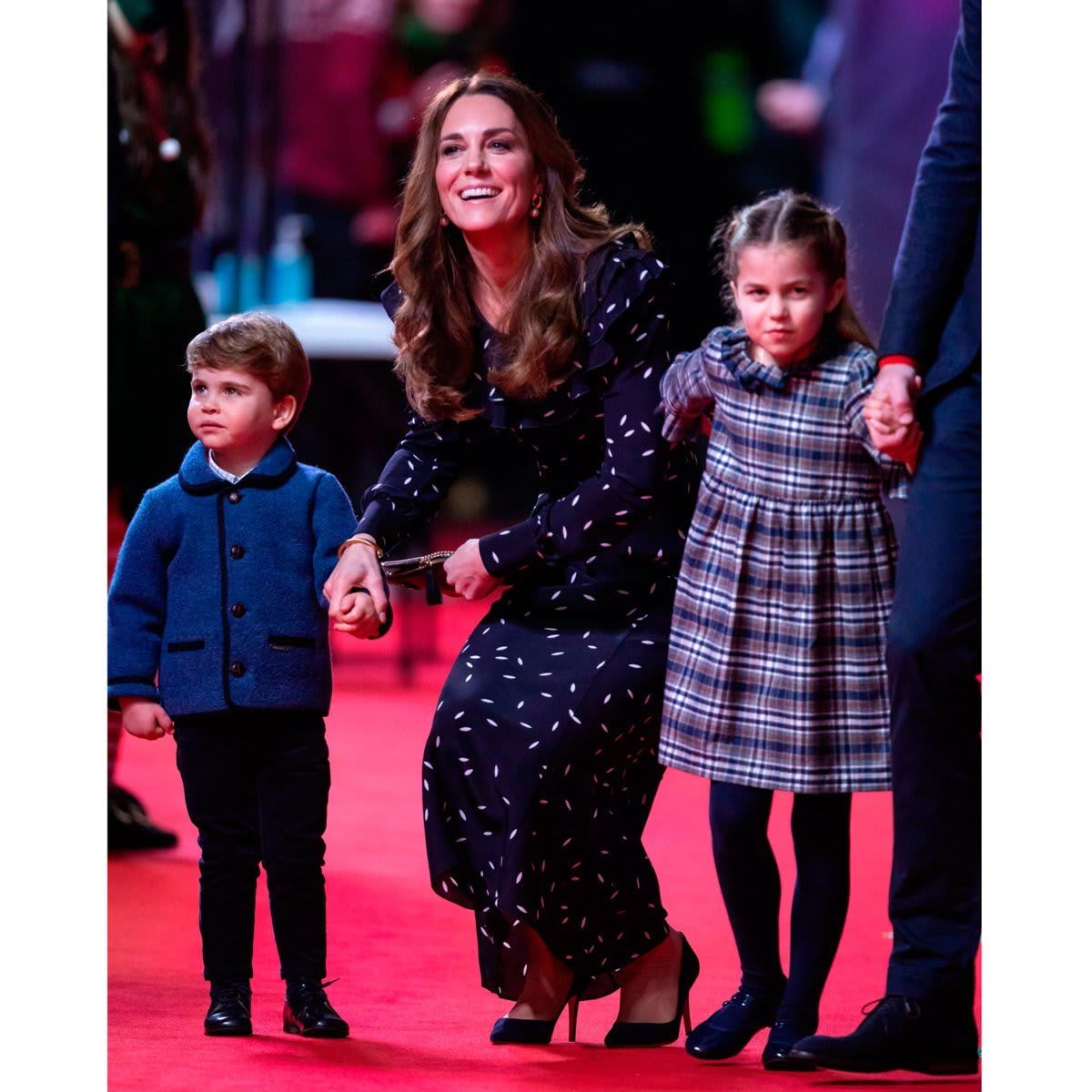Hands-on Kate held hands with her youngest son, while Charlotte reached for her mother.