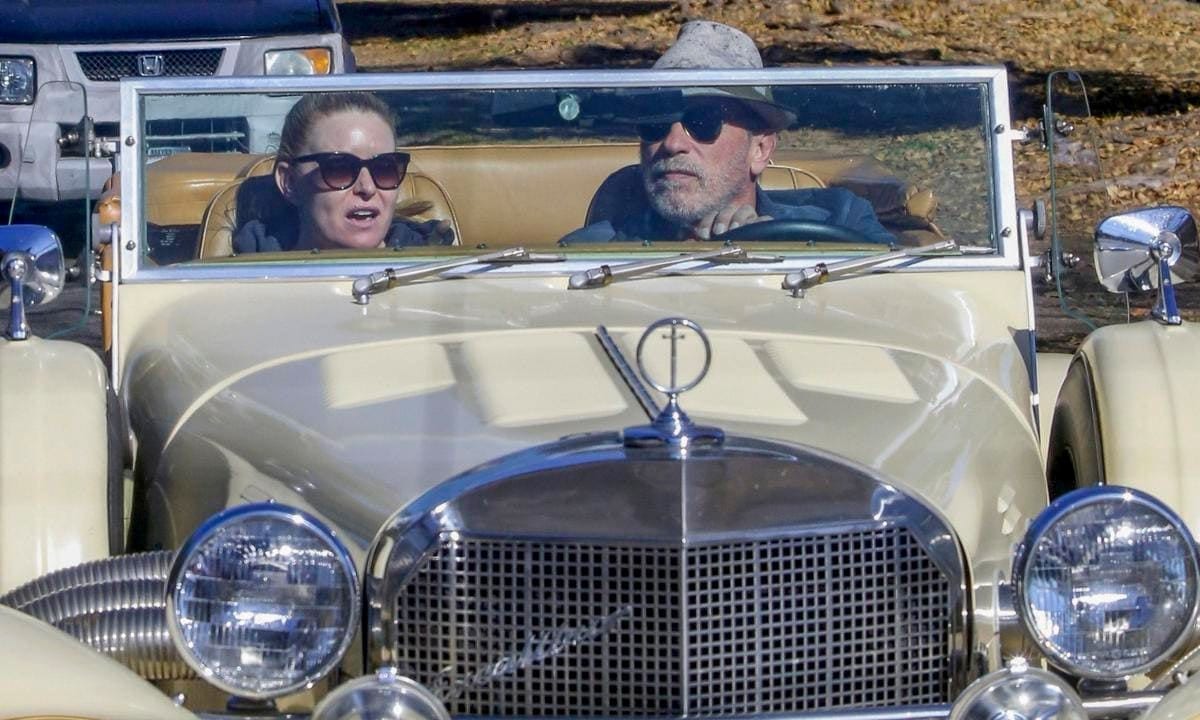 Arnold Schwarzenegger drives his classic Mercedes convertible