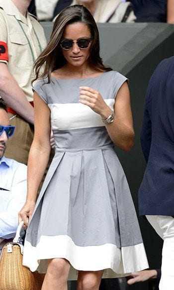 Pippa styled this grey-and-white color-blocked dress with her favorite wicker summer handbag.
<br>
Photo: Getty Images