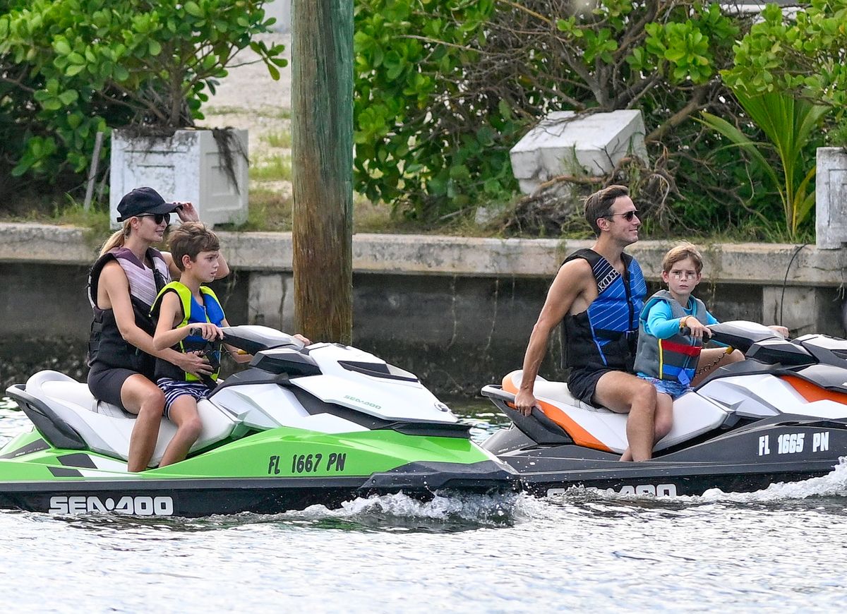 
Ivanka Trump and Jared Kushner teach their kids, Joseph and Theodore, to drive jet skis in Surfside, Florida. Theodore is seen with band-aids under both eyes.