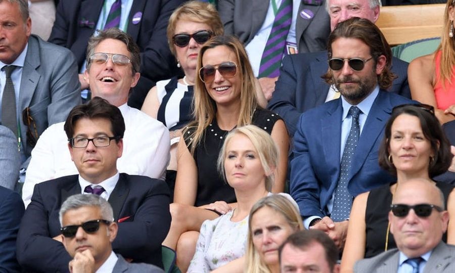 Hugh Grant and his girlfriend Anna Ebertsein sat next to Bradley Cooper during the men's final.
Photo: Getty Images