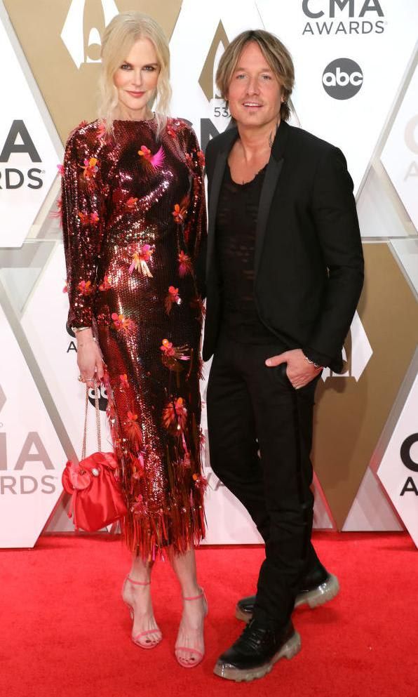 Nicole Kidman in a midi sequined dress and Keith Urban in a black jacket