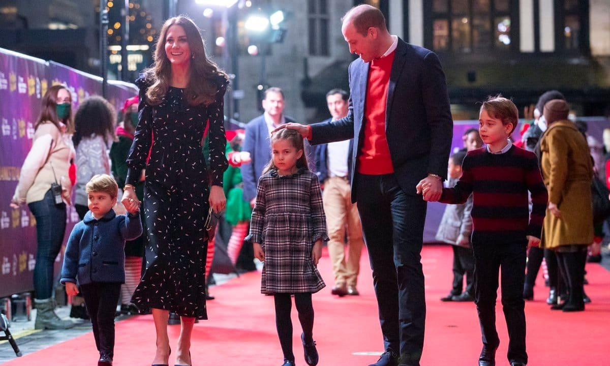 William sweetly patted the top of his little girl's head after she confidently let go of his hand on the red carpet.