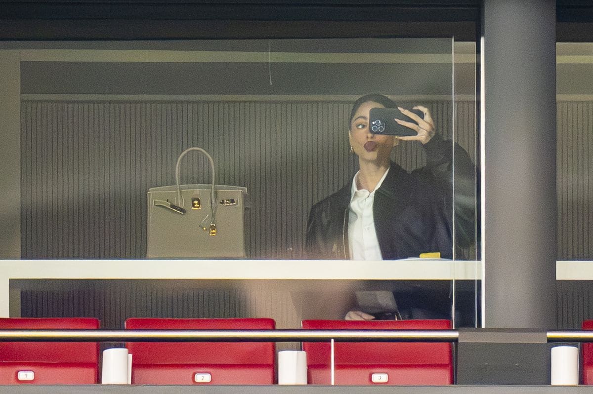 Tini Stoessel enjoying the match between Atletico Madrid and Real Madrid.