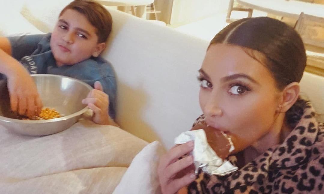 Kim Kardashian and Mason eating