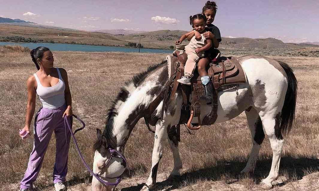 Kim Kardashian with her children on horseback