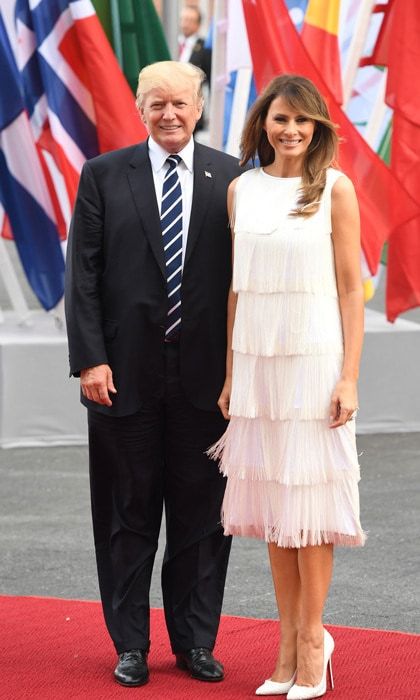 The First Lady of the United State gave off Gatsby vibes wearing a 1920s-inspired tiered fringe flapper dress by Michael Kors ($2995) to a concert at the Elbphilharmonie concert hall during the G20 Summit in Hamburg, Germany. Melania completed her stunning look with matching python Christian Louboutin pumps.
Photo: PATRIK STOLLARZ/AFP/Getty Images