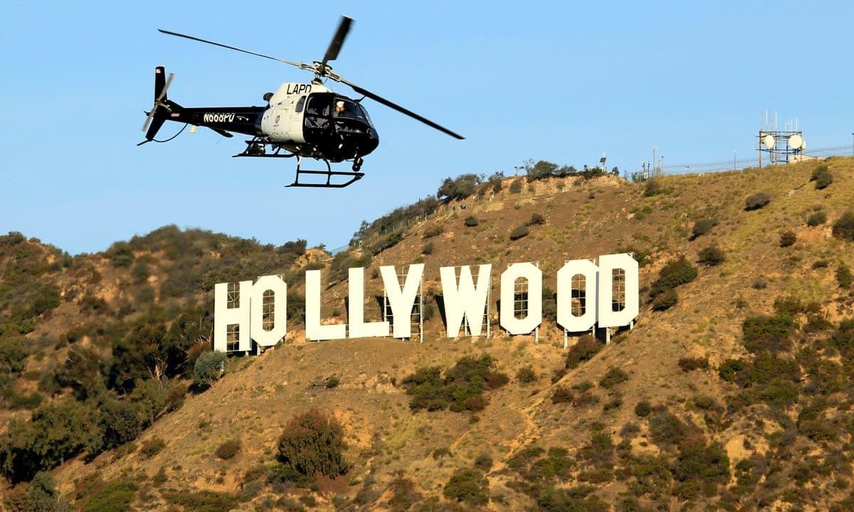 An LAPD helicopter searches the area above Bronson Canyon in Griffith Park, where detectives are in