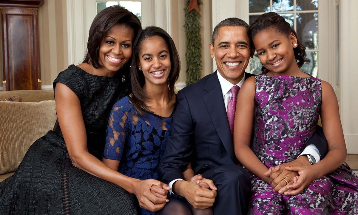 December 2011: It's obvious that the girls fashion sense has been growing with them and mom Michelle has been a big influence. During this holiday photo session, Sasha and Malia wore more sophisticated looks that went perfectly with mom's.
<br>
Photo: Getty Images