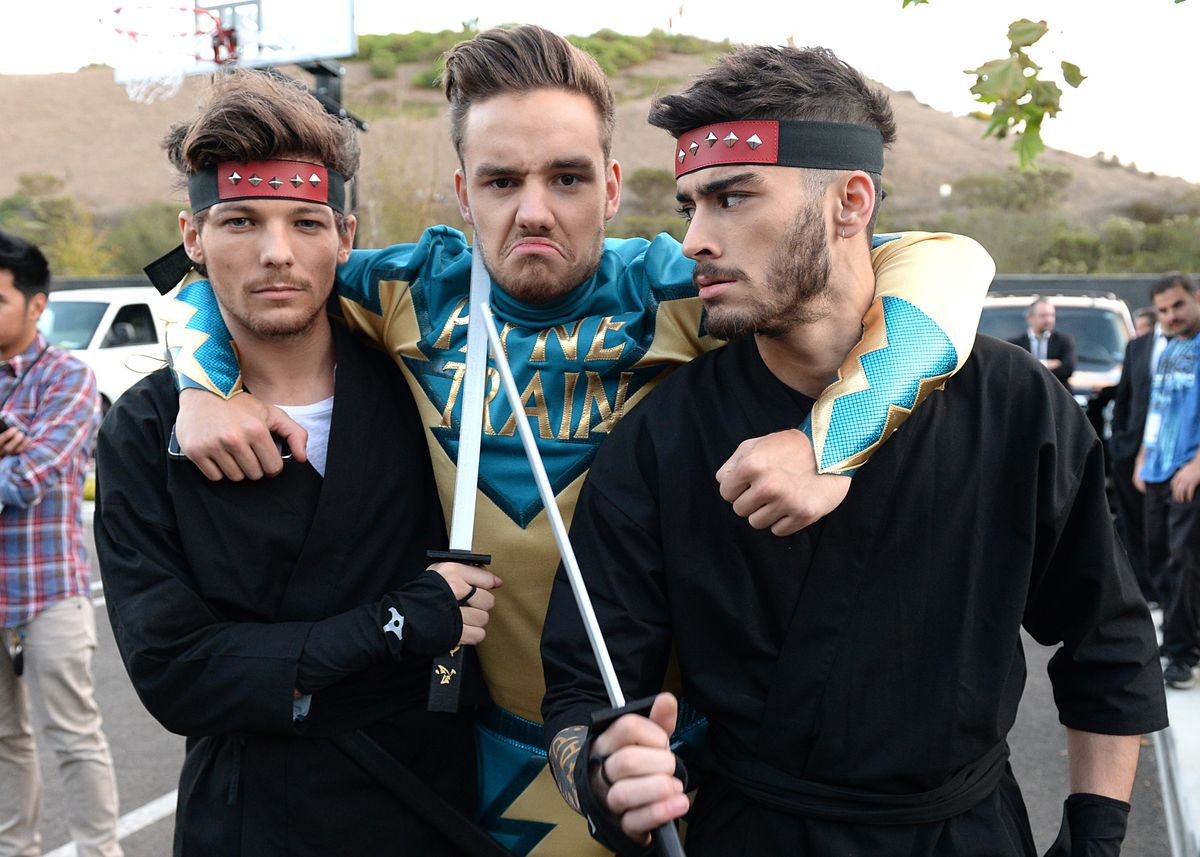 PLAYA VISTA, CA - NOVEMBER 23:  (L-R) Louis Tomlinson, Liam Payne, and Zayn Malik on set during One Direction celebrates 1D Day at YouTube Space LA, a 7-hour livestream event broadcast exclusively on YouTube and Google+. Featuring behind the scenes footage, Guinness world record attempts, and amazing special guests, the global event also marked the premiere of tracks from their new album 'Midnight Memories', set for release November 25th, in Playa Vista, California on November 23, 2013  (Photo by Jeff Kravitz/FilmMagic)