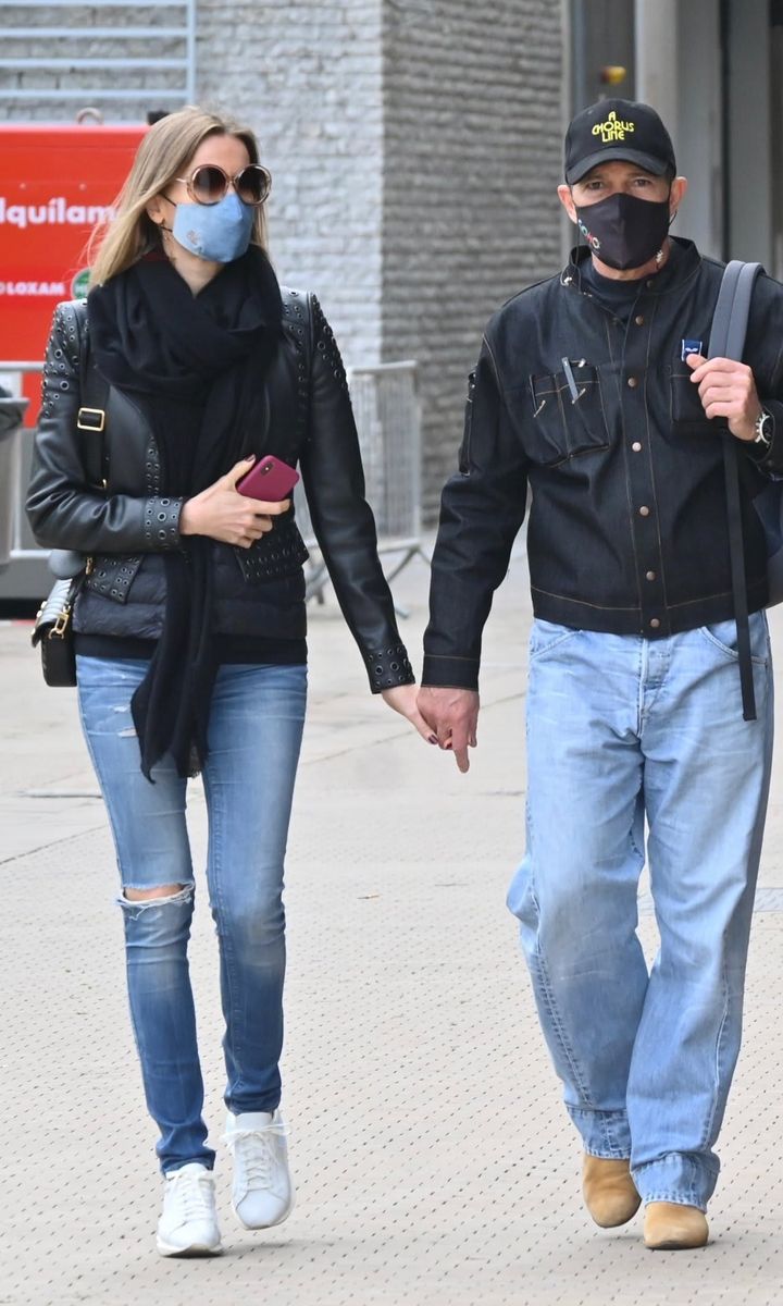 Antonio Banderas and Nicole Kimpel strolling around town together in Spain