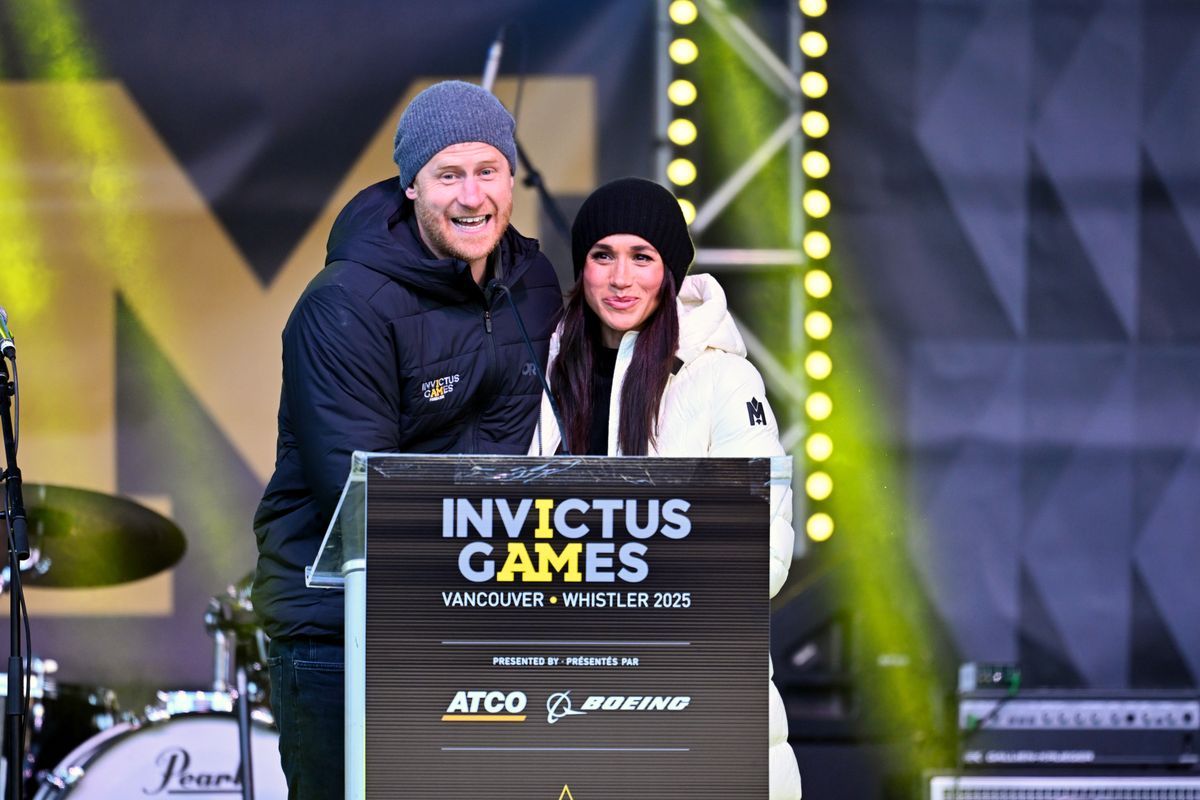 VANCOUVER, BRITISH COLUMBIA - FEBRUARY 10: Prince Harry, Duke of Sussex and Meghan, Duchess of Sussex speak on stage at the Whistler Welcoming Ceremony during day two of the 2025 Invictus Games on February 10, 2025 in Whistler, British Columbia. (Photo by Samir Hussein/WireImage)