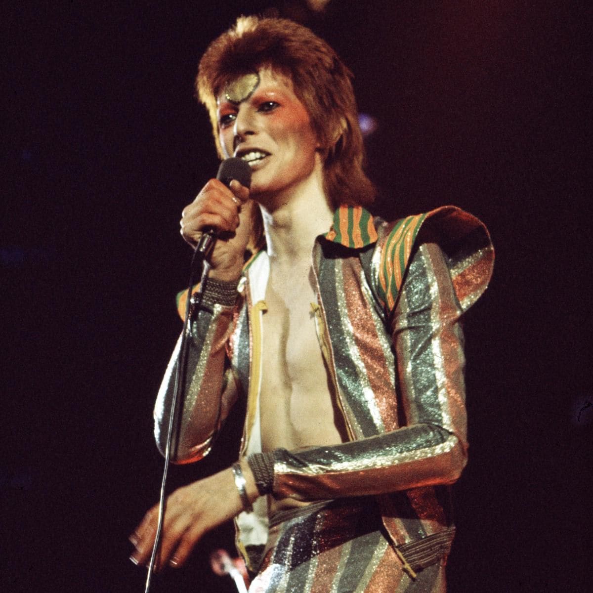 David Bowie portraying Ziggy Stardust onstage
