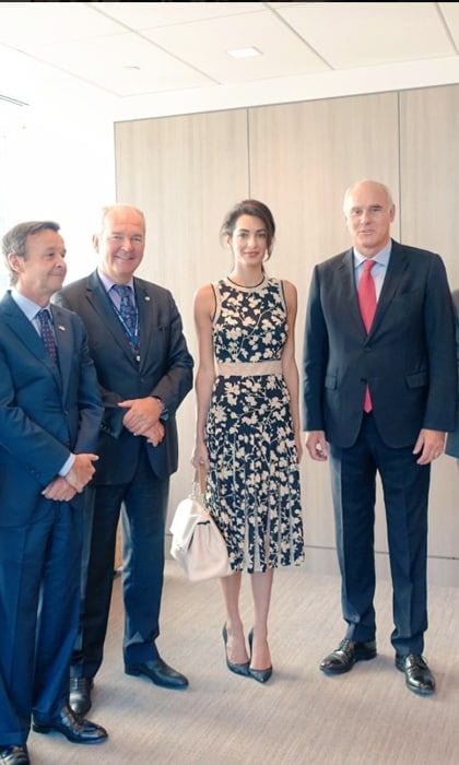 Amal made a floral statement donning a silk Michael Kors dress that featured a pleated hemline to meet with the Ambassador of the European Union to the United Nations, Joao Vale de Almeida (right).
Photo: Twitter/@ValedeAlmeidaEU