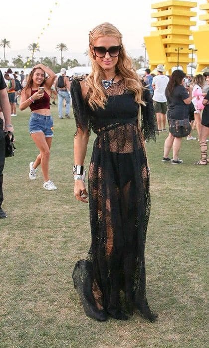 We'd expect nothing less than full-on glam from <b>Paris Hilton</B> and her see-through black lace dress and shades fit the bill.
<br>
Photo: Getty Images