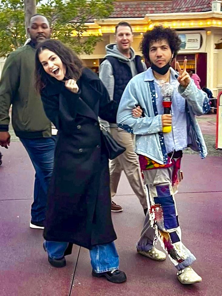 Selena Gomes and Benny Blanco can be seen leaving Disneyland. The pair were flanked by bodyguards and were accompanied by one VIP tour guide. The couple spent about two hours at the happiest place on earth before heading out.