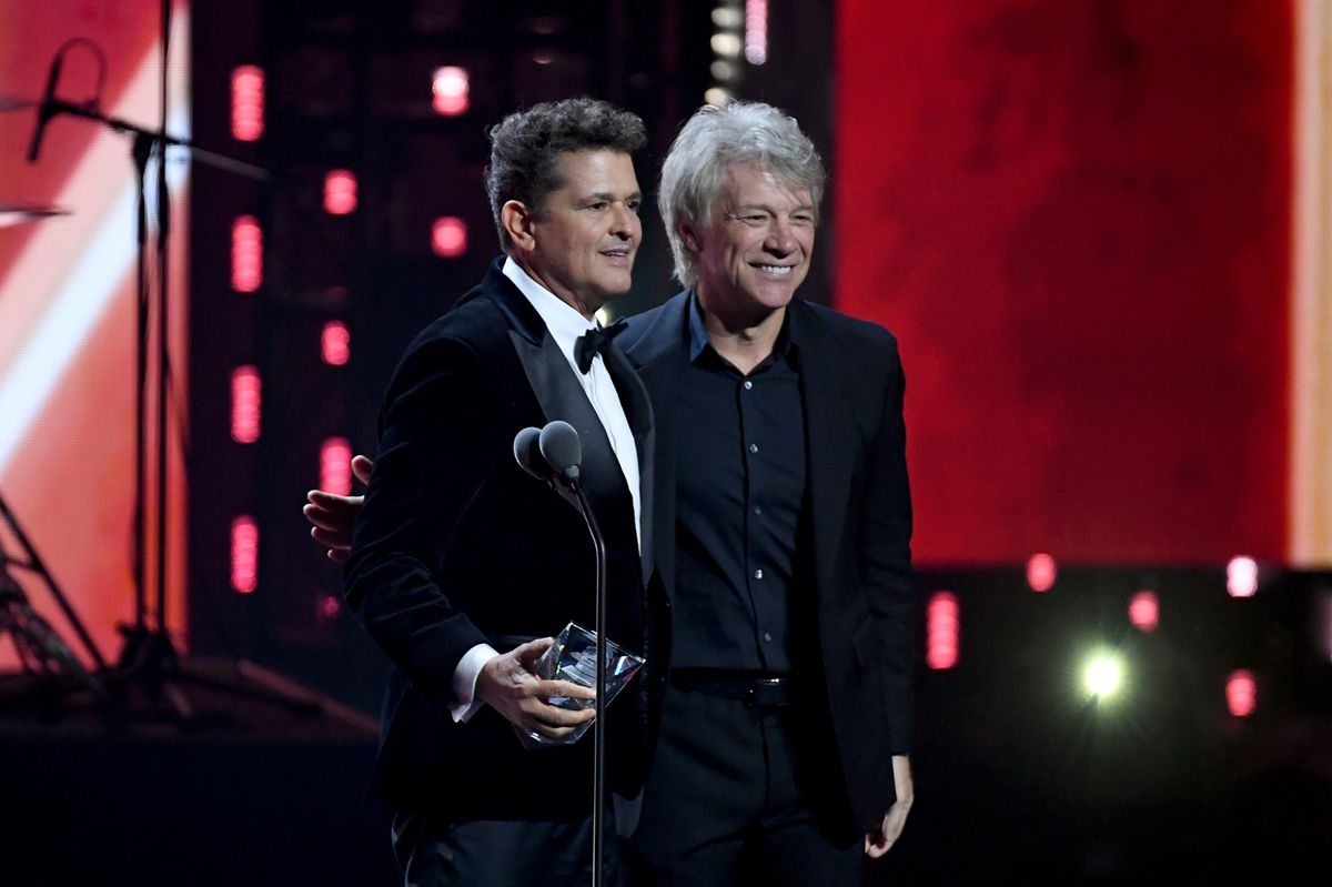 Carlos Vives accepts the 2024 Person of the Year Award from Jon Bon Jovi 