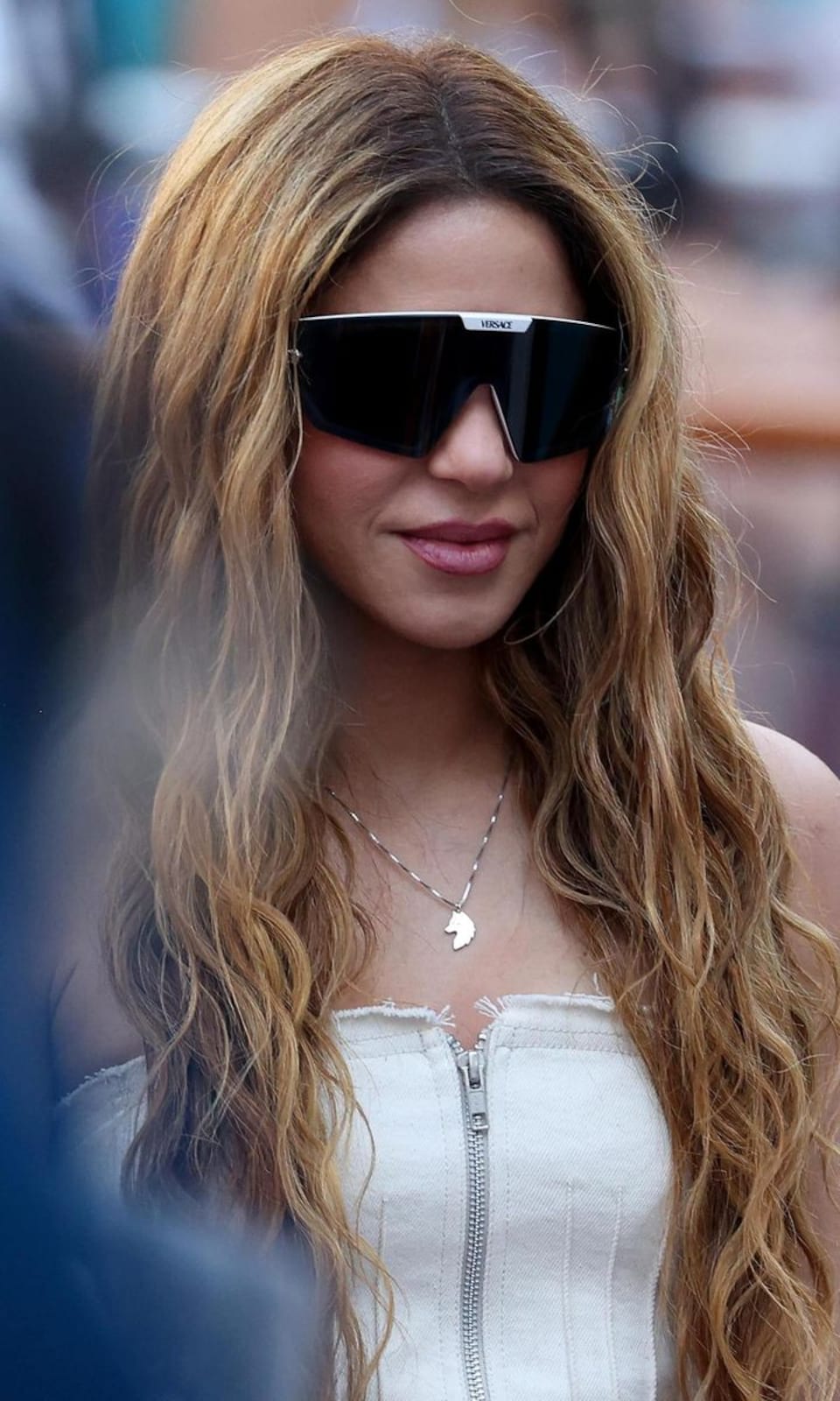 Shakira wears a she-wolf necklace at the Miami Open