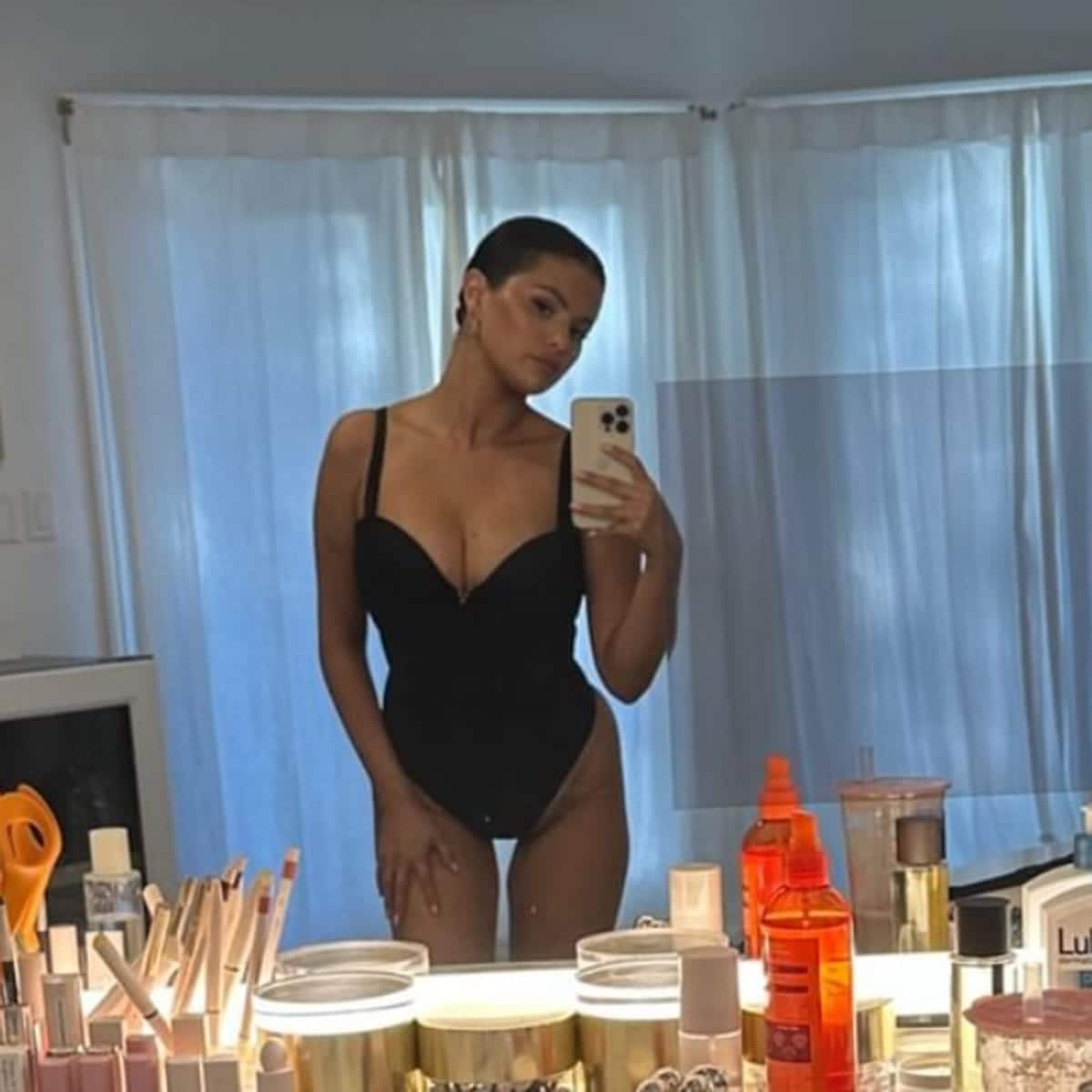 Selena Gomez radiates confidence in stylish black one piece swimsuit