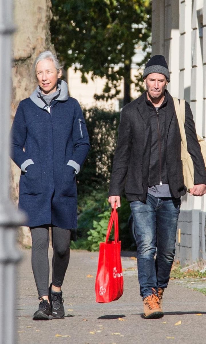 Keanu Reeves and Alexandra Grant walking in Berlin