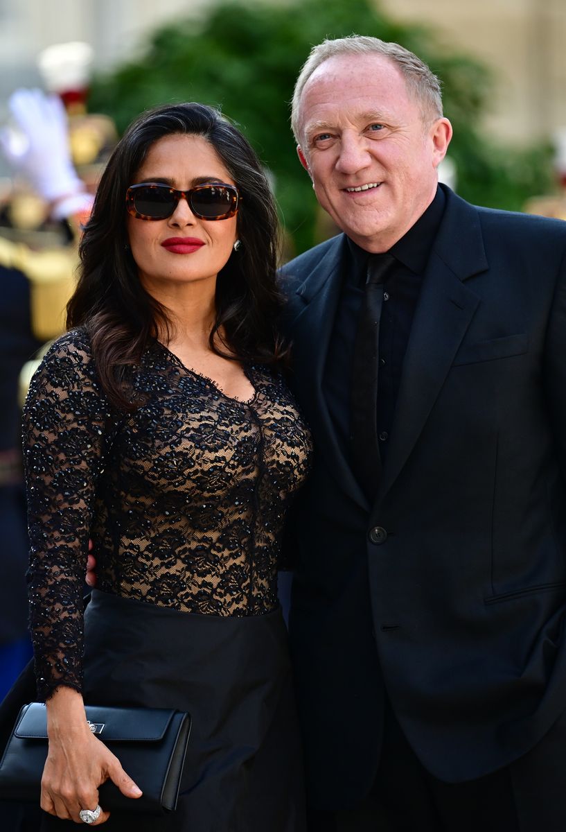 Salma Hayek and husband Francois-Henri Pinault arrive to attend an official state dinner as part of US President's state visit to France, at the Presidential Elysee Palace on June 08, 2024 in Paris, France. U.S. President Joe Biden is in France to commemorate the 80th anniversary of the invasion of Normandy and to emphasize the continued role of the United States in helping to protect democratic values in Europe. (Photo by Christian Liewig - Corbis/Corbis via Getty Images)