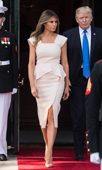 The first lady walked out of the White House out to help greet South Korean President Moon Jae-in wearing a signature peplum silhouette by Roland Mouret on June 29.
Photo: NICHOLAS KAMM/AFP/Getty Images