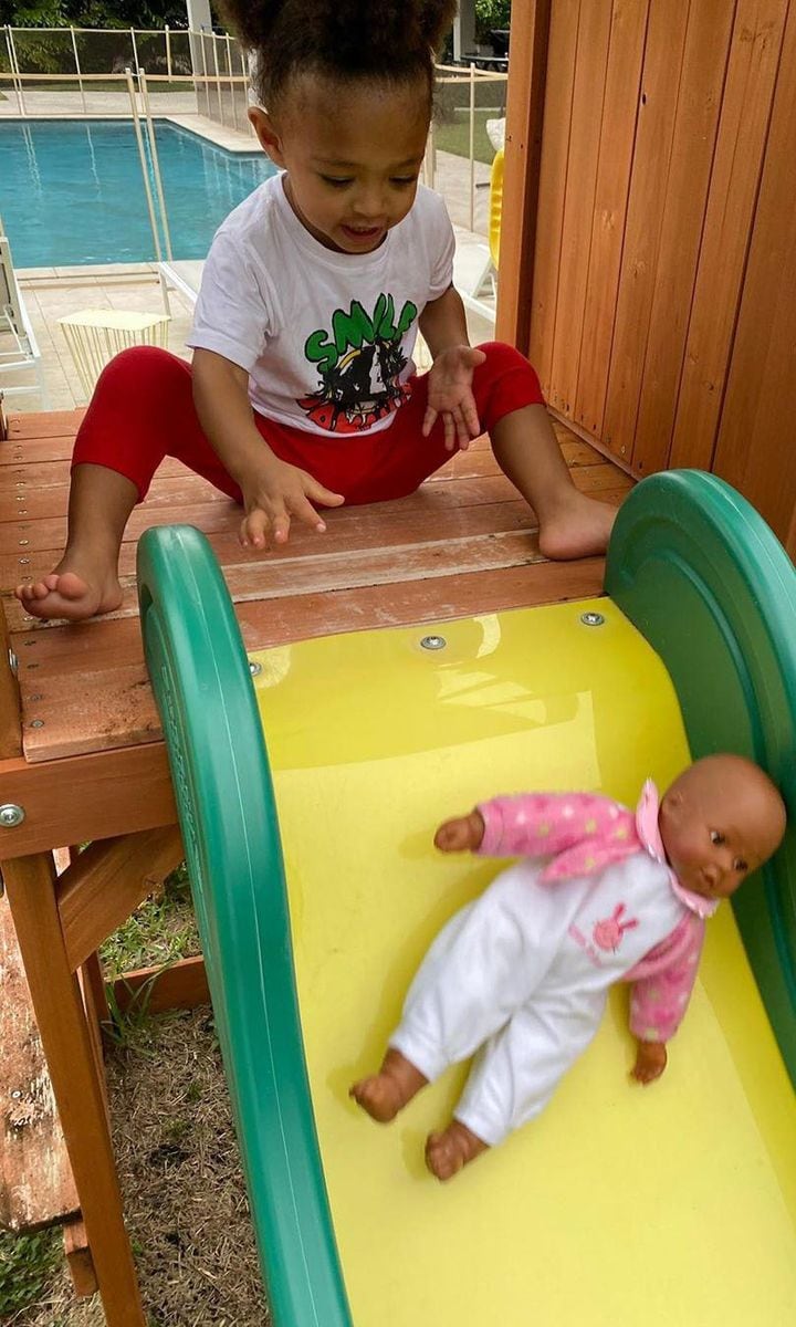 Serena Williams' daughter Olympia playing with Qai Qai