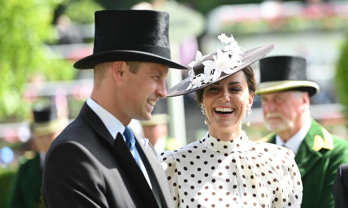 The Duchess accessorized her dress with a black hat and a dazzling pair of Princess Diana's earrings.