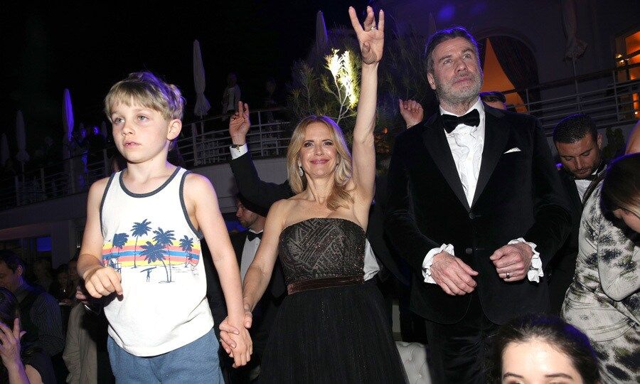 Kelly Preston had one hand in the air and the other in her young son Benjamin's hand as she danced along to the music during the reception.
Photo: Getty Images