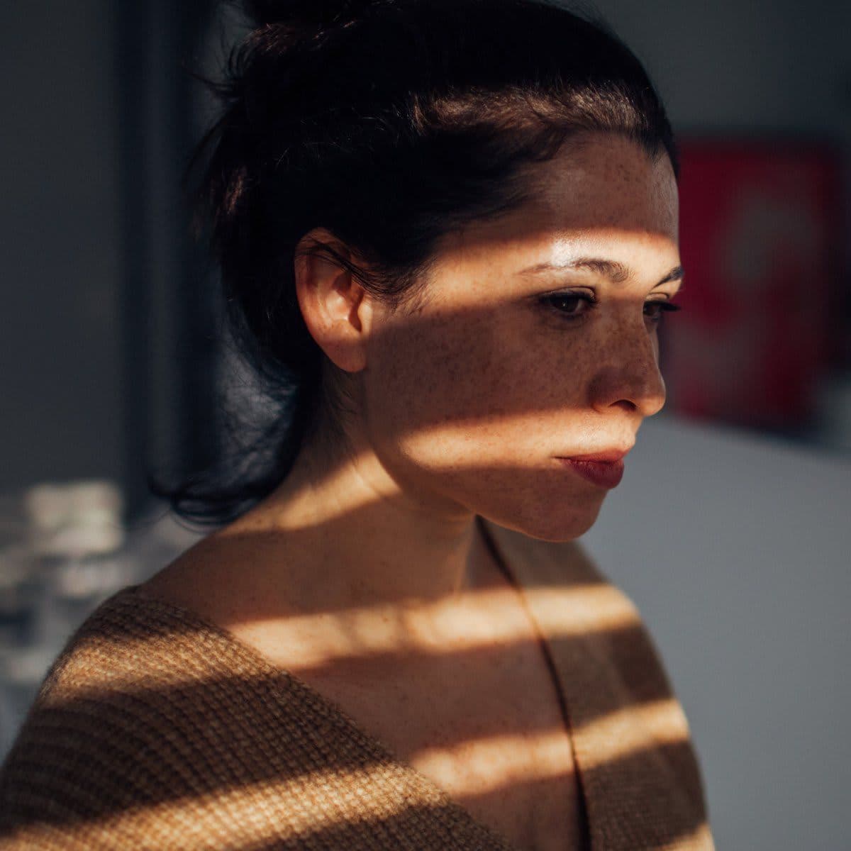 Portrait of young woman in her apartment