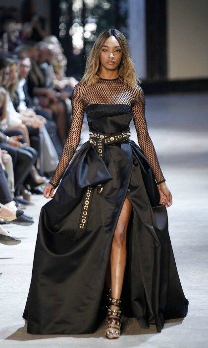 <a href="https://us.hellomagazine.com/tags/1/Jourdan-Dunn" target="_blank" style="font-weight: bold;">Jourdan Dunn</a> took to the catwalk in a dramatic black ballgown that featured mesh sleeves and a thigh-high slit at the Alexandre Vauthier Haute Couture show.
<br>
Photo: Thierry Chesnot/Getty Images