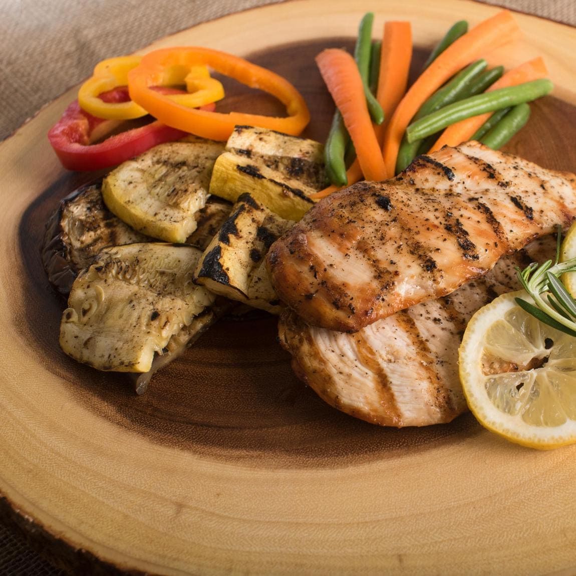 Plate of grilled chicken with vegetables