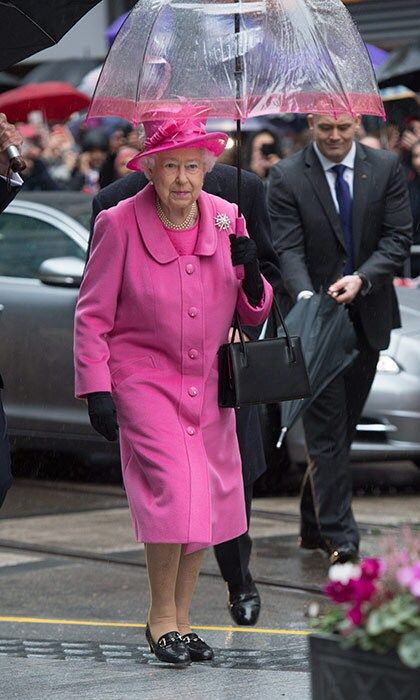 Queen Elizabeth ll sported a pink ensemble and carried an umbrella to match! during a visit to Birmingham, England.
Picture by Anwar Hussein EMPICS Entertainment