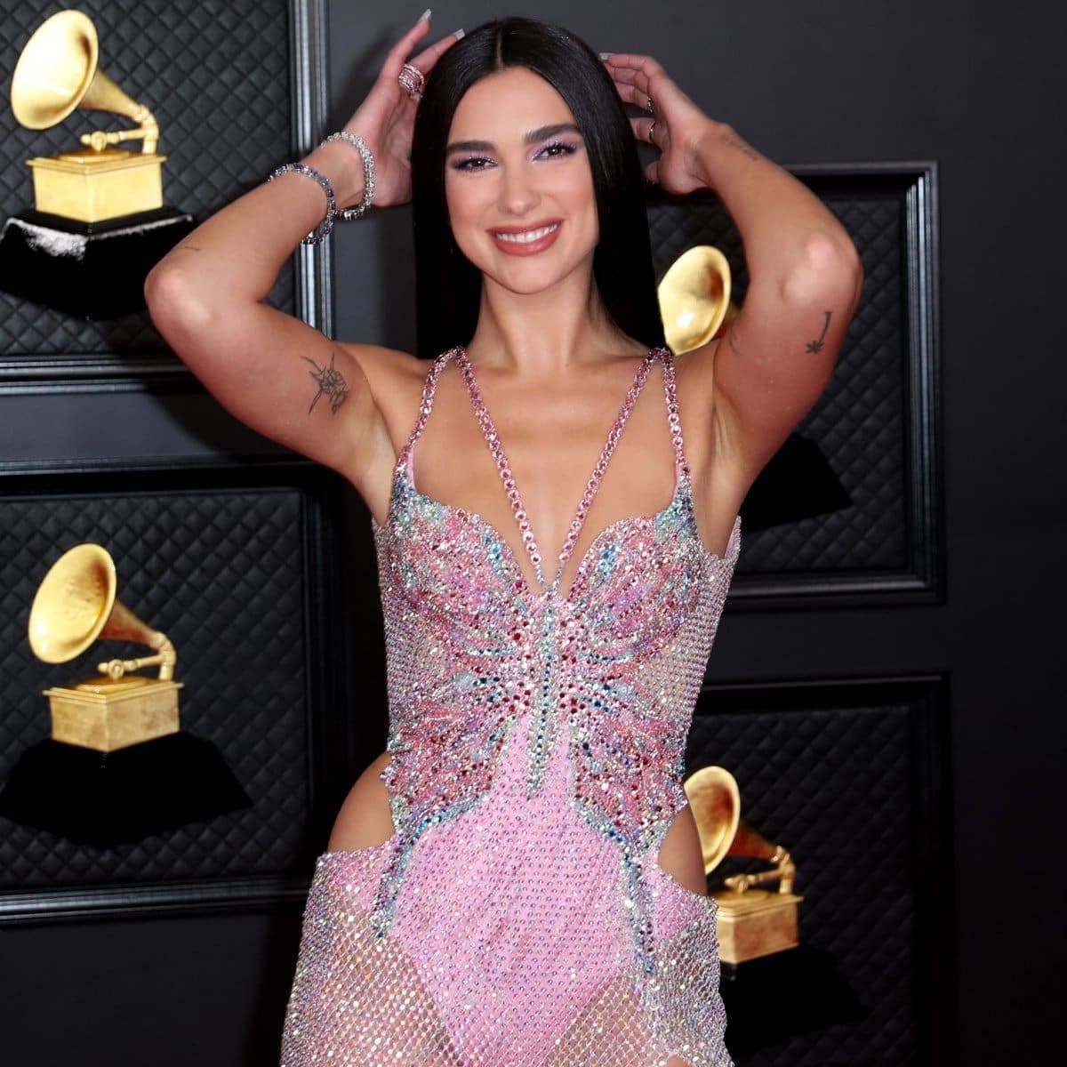 Musical talent pose on the red carpet at the 63rd Annual Grammy Awards show in downtown Los Angeles