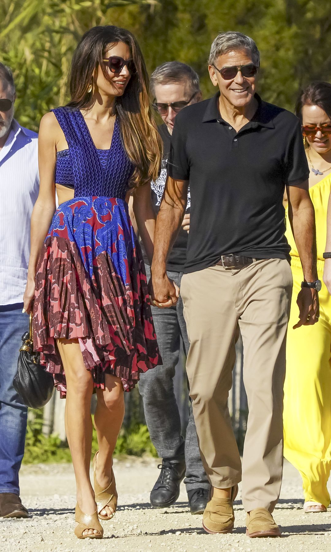 George and Amal Clooney holding hands in Saint-Tropez 