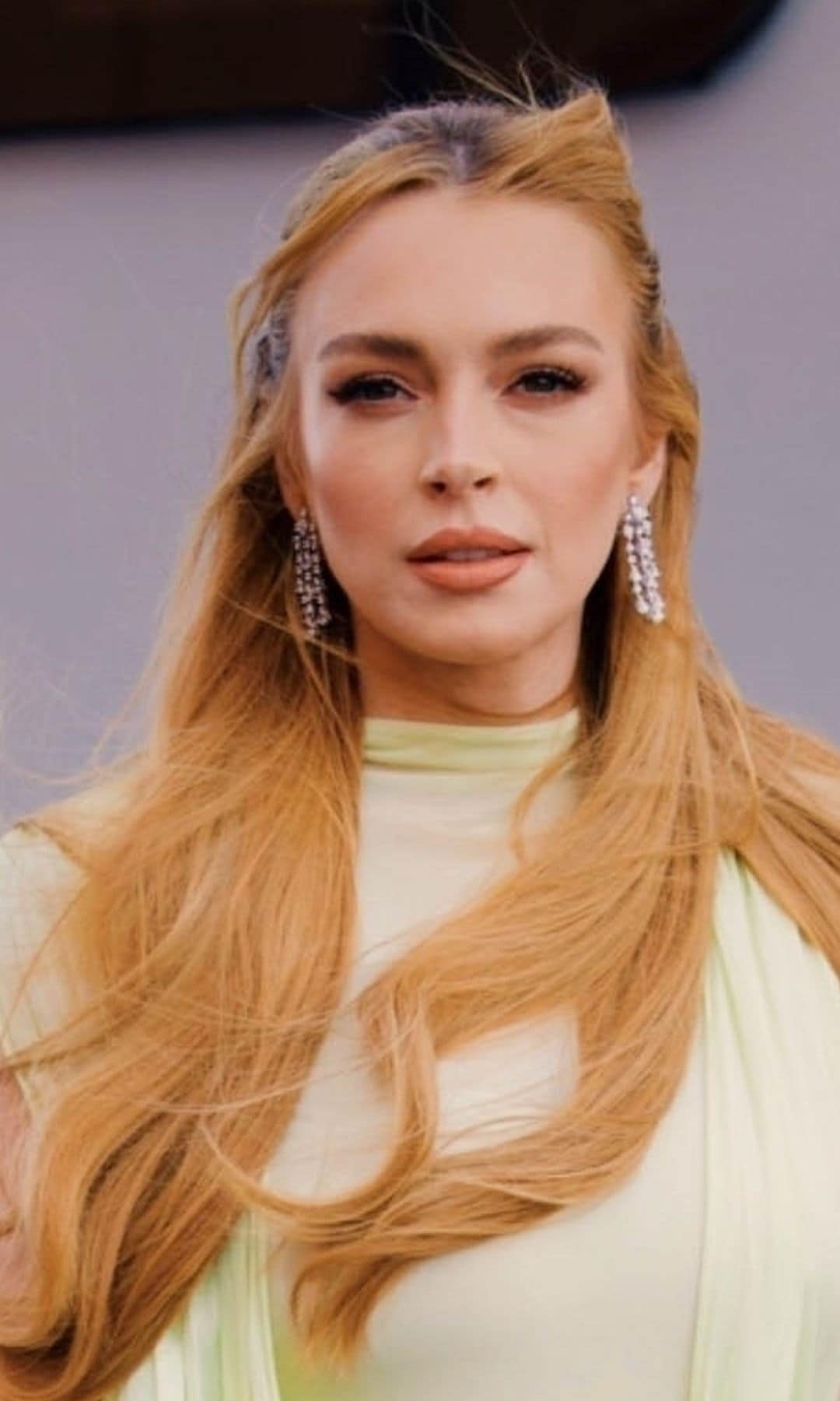 Lindsay Lohan shows off glamorous look including metallic heels and diamond earrings